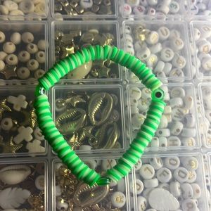 This is a green eye clay bead bracelet👀